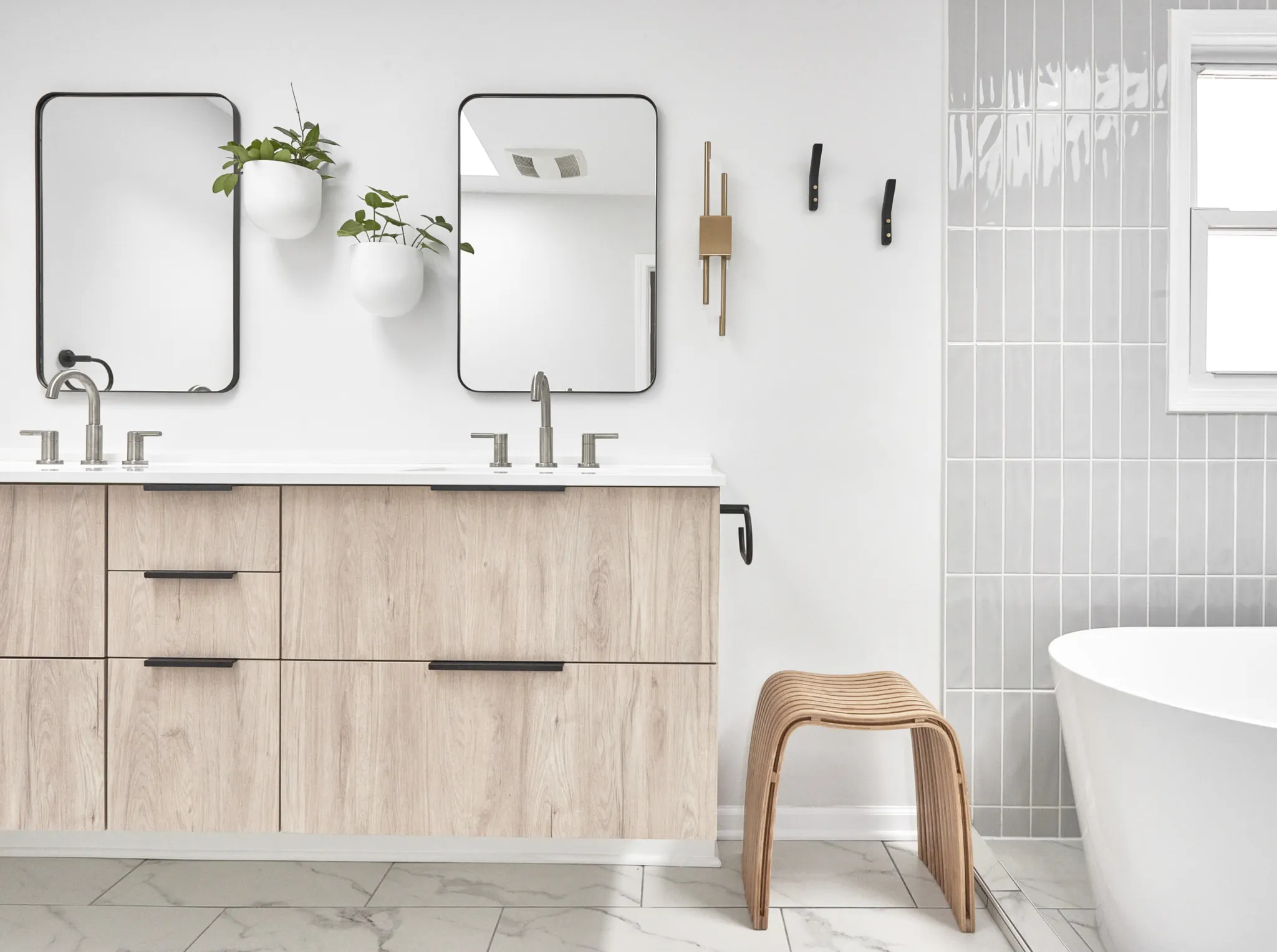 Light wood vanities in renovated bathroom